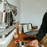 a man standing in a kitchen preparing food