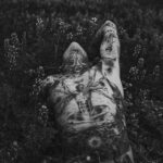 man lying on plants